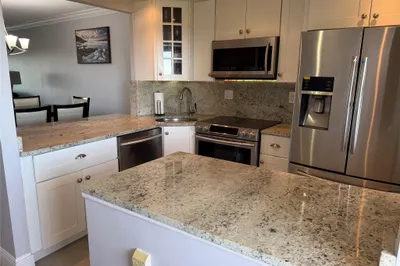 Open, updated kitchen with s/s appliances