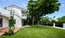 Rear of house with Double patio and expansive lawn