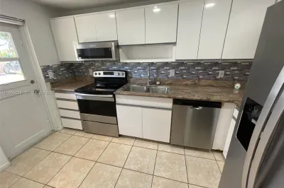 Kitchen with New Stainless Steel Appliances and Re