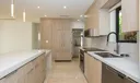Stunning kitchen with elongated quartz island