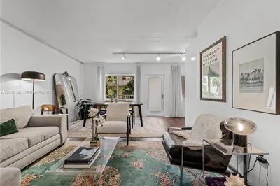 A bright, eclectic living space with white walls a