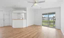 Living room to kitchen and screened patio