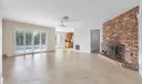 LR with /fireplace /pool & waterfront views