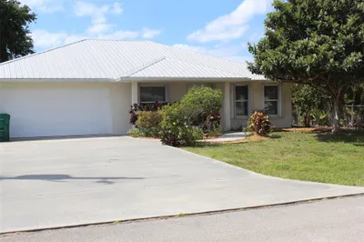 Front View, beautifully landscaped -two car garage
