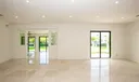 Living area with waterviews form every opening