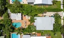 Aerial views of this exquisite villa with private guest house, pool and outdoor amenities to enjoy with family & friends.