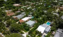 Aerial views of this exquisite villa with private guest house, pool and outdoor amenities to enjoy with family & friends.