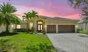 The generous paved drive way welcomes you to this beautiful 5/3/3CG waterfront home with resort backyard!