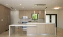 Stunning kitchen with elongated quartz island