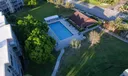 Drone Shot Of Sabal Palm Condo Main Pool