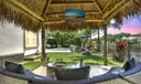 $100K Resort Backyard retreat with fully fenced garden, beautiful landscaping, salt-water pool with sun-shelf, waterfall, multi-colored lights, tiki hut with mounted TV (couch, table and TV included!) Oh, and lovely water views!