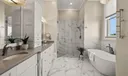 Master Bath with Dual Sinks and Glass Walled Shower