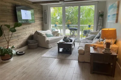 spacious living room with walk out balcony