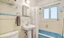 Guest bathroom with combination tub / shower