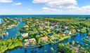 This Stunning Waterfront Home is Nestled Within an Exclusive Gated Community!