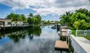 Brand new raised concrete seawall w/ a 30 foot dock (2023