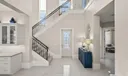 View of the front door and stairway