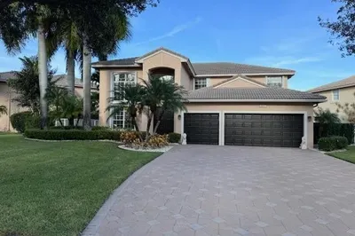 FRONT OF HOME WITH EXTRA LONG DRIVEWAY
