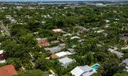 Aerial views of this exquisite villa with private guest house, pool and outdoor amenities to enjoy with family & friends.