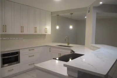 UPDATED OPEN KITCHEN INTO DINING & LIVING AREA