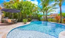 Newer travertine pool deck, salt waterpool with sunshelf, waterfall, multi-color lights!