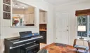 looking in to kitchen and to door that leads to backyard