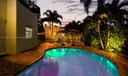 Sip cocktails pool side while enjoying the romantic sunset among friends and family