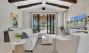 ndoor-Outdoor living through huge hurricane sliders to covered patio