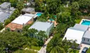 Aerial views of this exquisite villa with private guest house, pool and outdoor amenities to enjoy with family & friends.