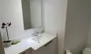 Full bathroom in front of den/bedroom area
