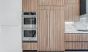 Beautiful Built In Paneled Refrigerator and Double Oven