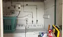 Laundry room right outside kitchen area door that leads to Backyard.