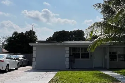Front of house showing driveway. 4 care, or 2 cars