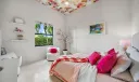 Third bedroom suite with full bathroom, walk-in closet and access to safe room.