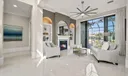 Living room with Gas Fireplace opens to the Lanai