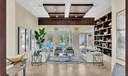 14 foot ceilings and a direct view of the expansive patio is you and your guests' first impression inside the home