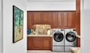 This large laundry room has counter space on the left and right side