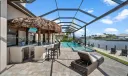Tiki bar, outdoor kitchen with plenty of lounge area
