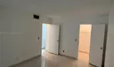 Bedroom with walk-in closet