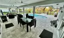 Large Covered patio/pool area with outdoor shower