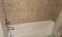 Remodeled Second Bathroom Cast Iron Tub. You can enter From The Guest Bedroom And Foyer For Guest To Enter
