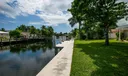 Brand new raised concrete seawall w/ a 30 foot dock (2023