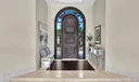 The entrance door was carved out of one solid piece of wood and opens / closes smoother than butter