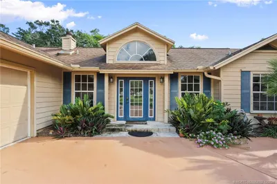 Front with oversized driveway