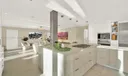 Discover a Kitchen With High-End Finishes and a Massive Quartz Countertop!