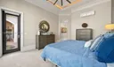 Master Suite opens to the Lanai and Pool