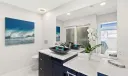 Custom built vanity with Quartz countertops.