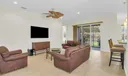 Living room overlooks patio and is open to the kitchen