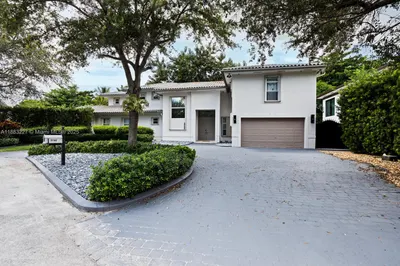 Beautiful two-story home with stucco exterior, til
