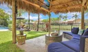 Relish in a tropical shaded tiki hut - feels like a vacation right at home!
